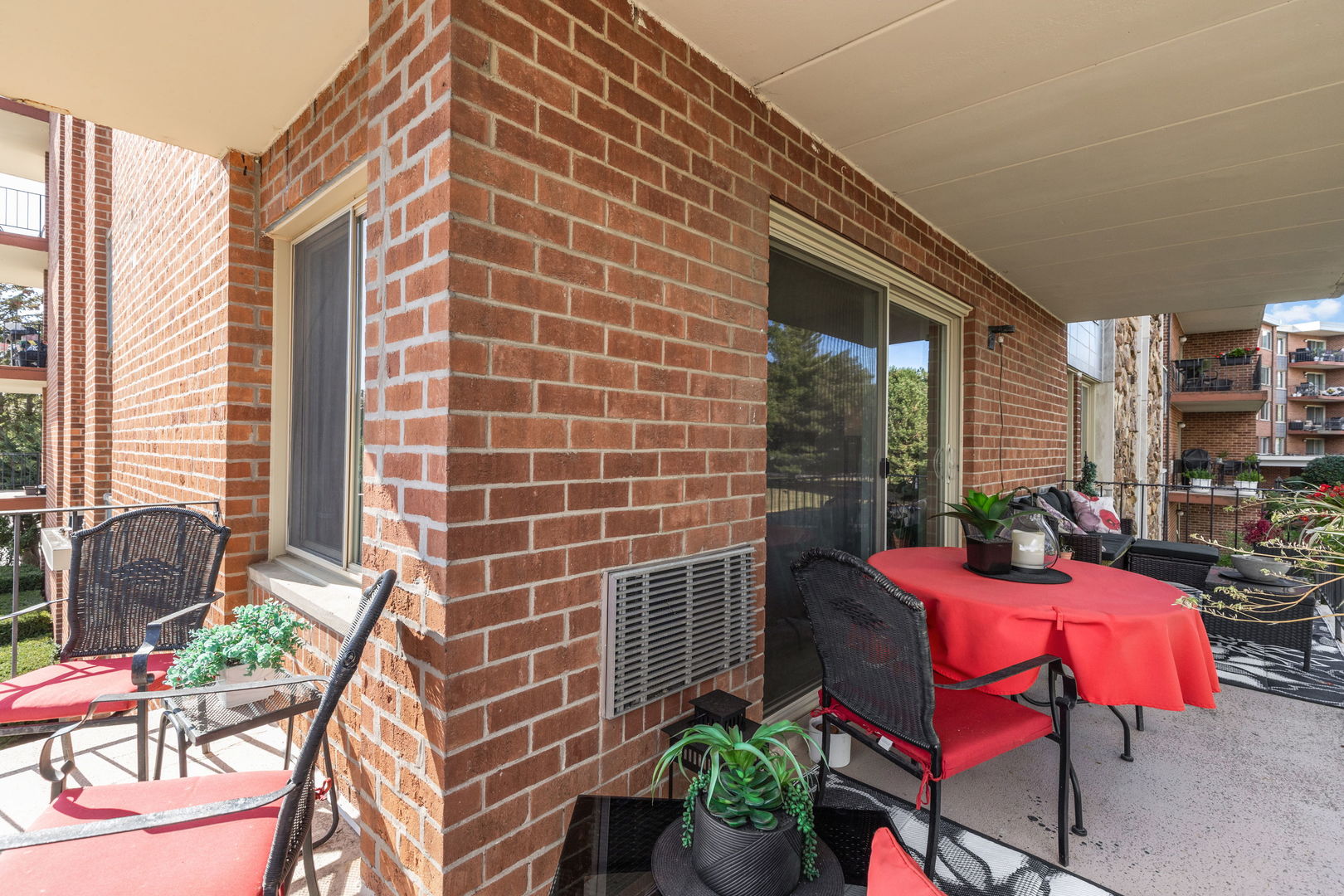 18 East Old Willow Road, Unit 210N Prospect Heights, IL 60070 - Photo 17 of 18 a view of a patio with couches table and chairs and potted plants