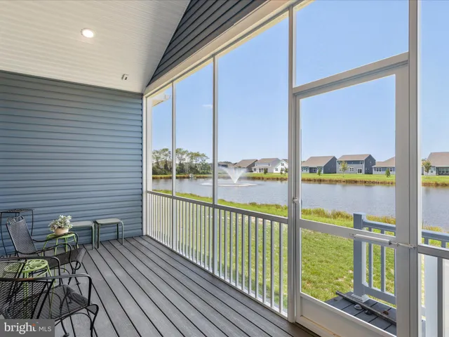 a view of a balcony with wooden floor