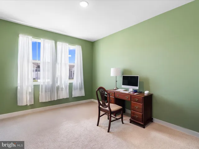 a kitchen with stainless steel appliances kitchen island granite countertop a sink a stove and a wooden floors