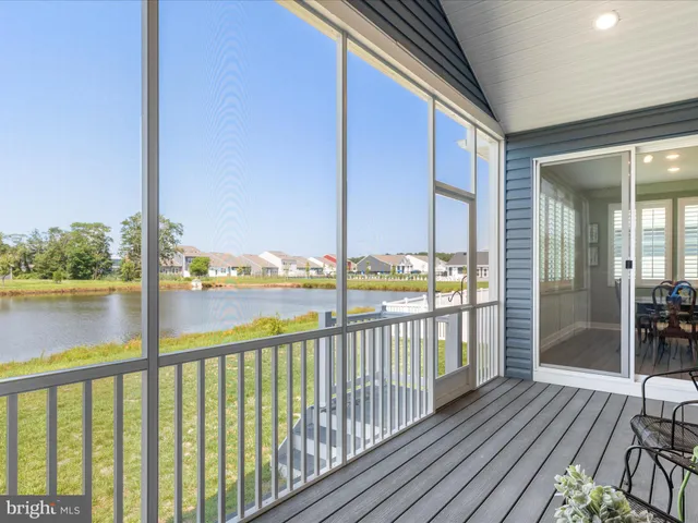 a kitchen with stainless steel appliances granite countertop a sink a stove and a wooden floors
