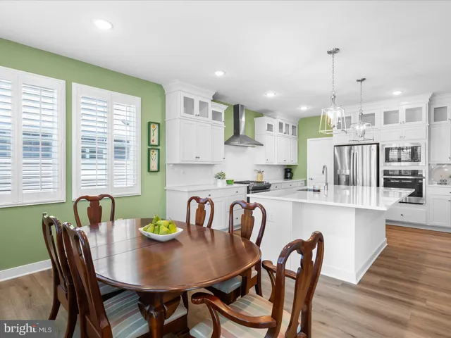 a view of a balcony with chair and wooden floor