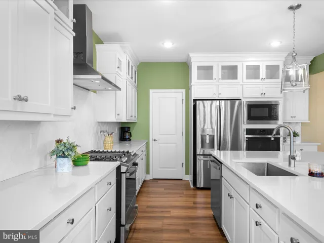 a living room with furniture large window and fireplace