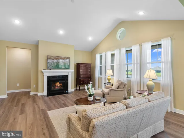 a view of a lake with a houses in the back