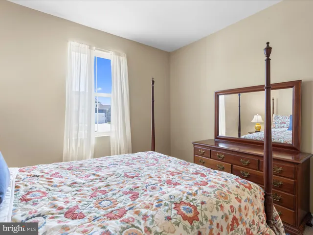 a front view of a house with a yard table and chairs