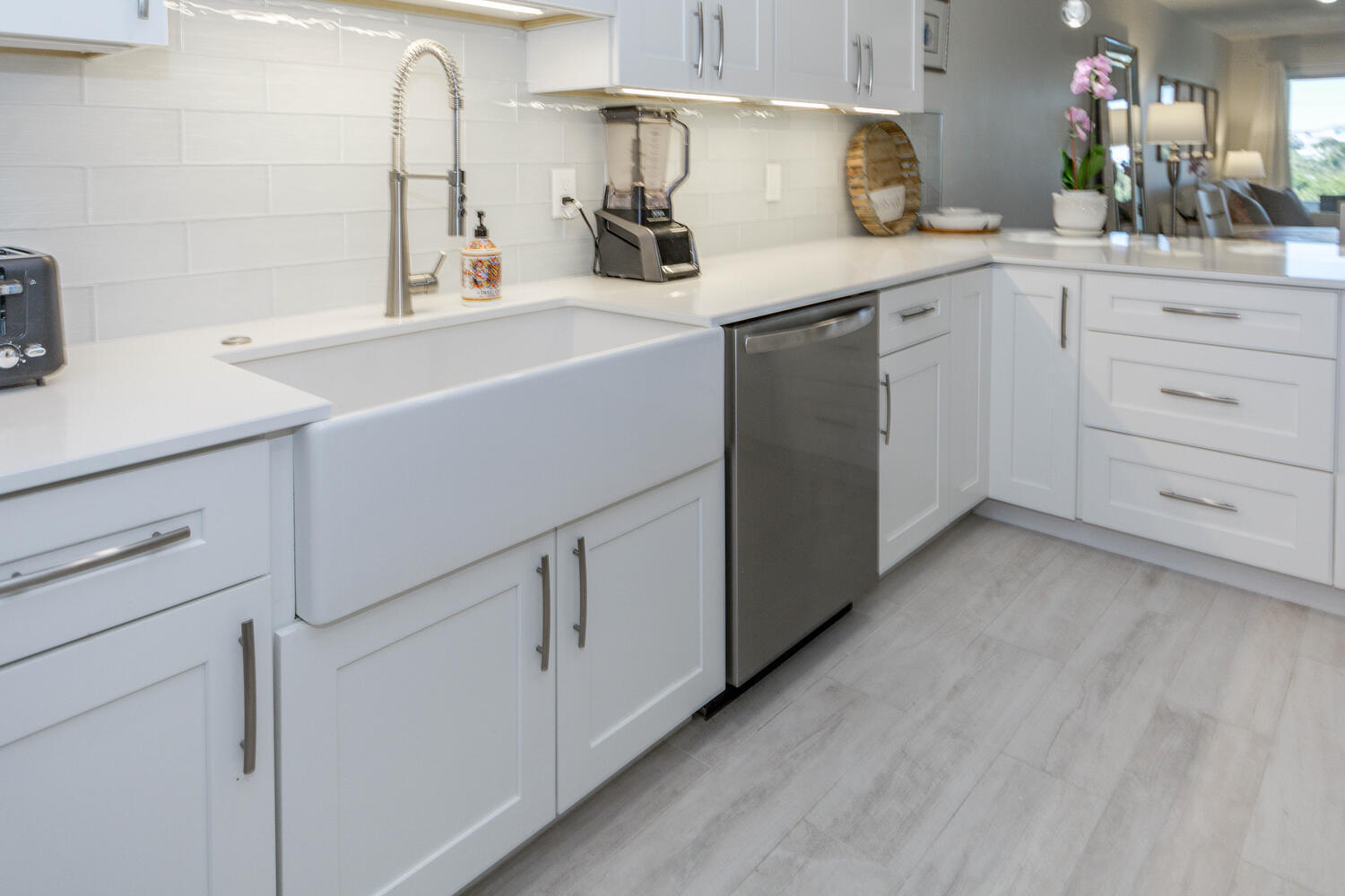 120 Celestial Way, Unit 302 Juno Beach, FL 33408 - Photo 11 of 55 a kitchen with cabinets appliances a sink and a counter top space