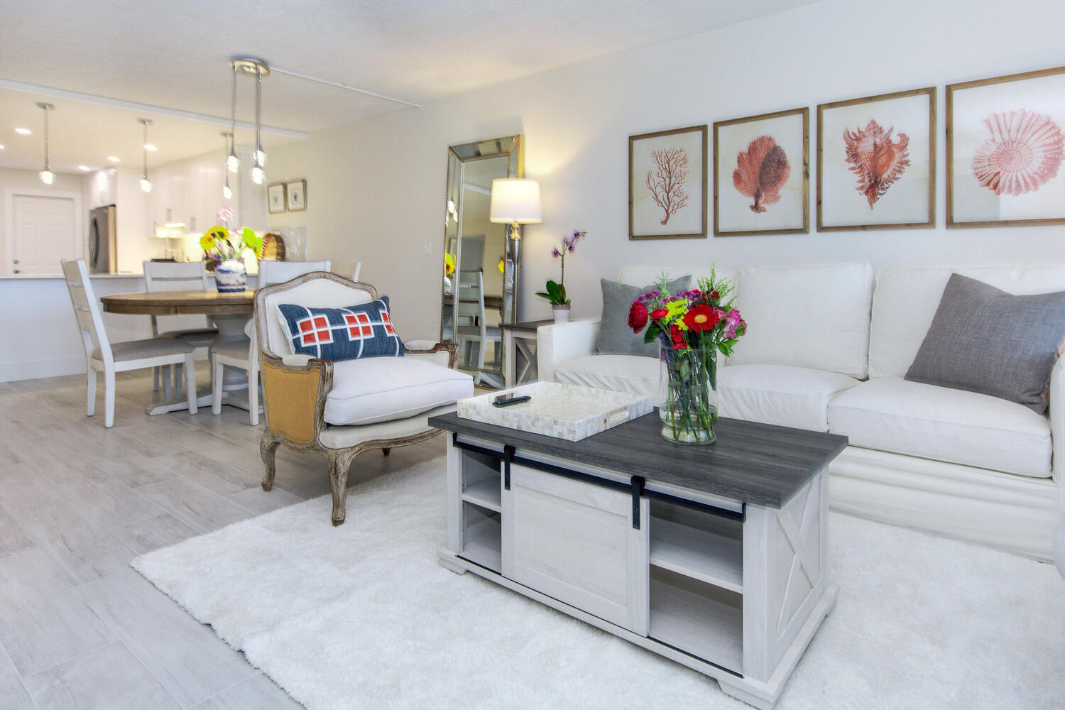 120 Celestial Way, Unit 302 Juno Beach, FL 33408 - Photo 14 of 55 a living room with furniture and flowers