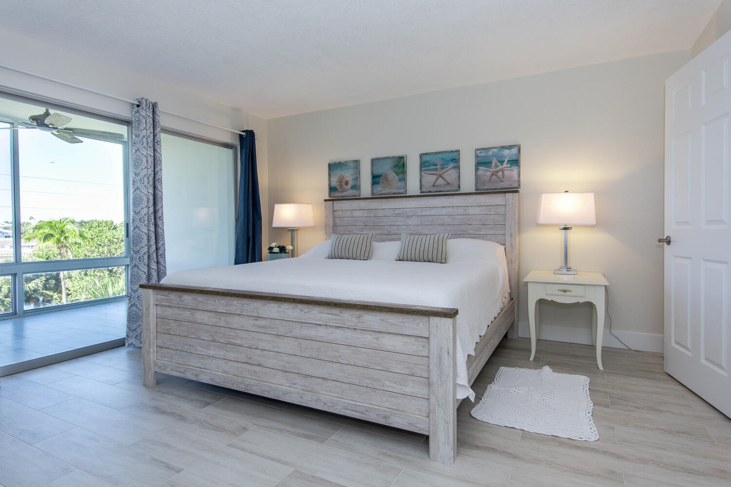 120 Celestial Way, Unit 302 Juno Beach, FL 33408 - Photo 18 of 55 a bedroom with a bed and a window