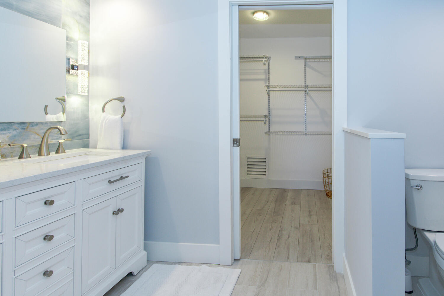 120 Celestial Way, Unit 302 Juno Beach, FL 33408 - Photo 23 of 55 a bathroom with a double vanity sink and mirror