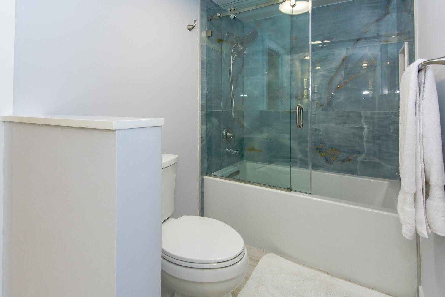 120 Celestial Way, Unit 302 Juno Beach, FL 33408 - Photo 24 of 55 a bathroom with a shower and a toilet