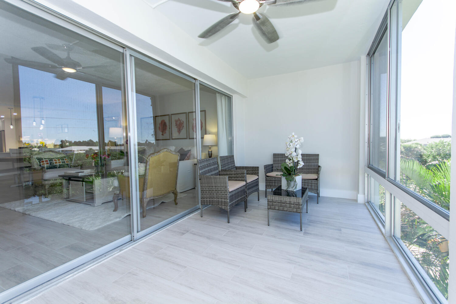 120 Celestial Way, Unit 302 Juno Beach, FL 33408 - Photo 34 of 55 a dining room with furniture and a floor to ceiling window