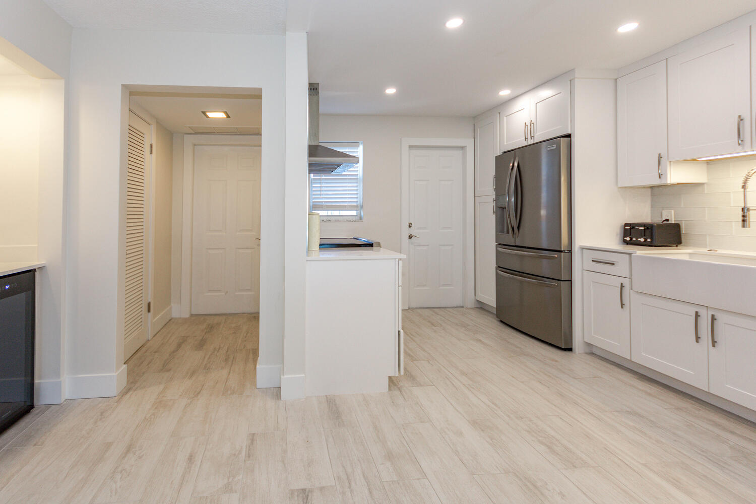 120 Celestial Way, Unit 302 Juno Beach, FL 33408 - Photo 4 of 55 a kitchen with stainless steel appliances a refrigerator and a stove top oven