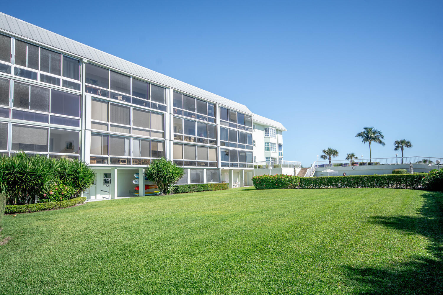120 Celestial Way, Unit 302 Juno Beach, FL 33408 - Photo 47 of 55 a view of a building with garden