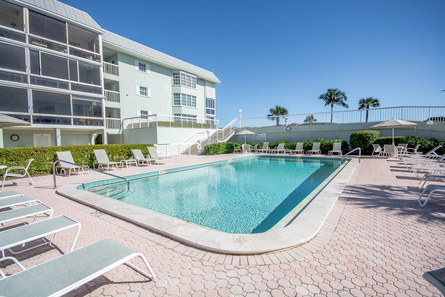120 Celestial Way, Unit 302 Juno Beach, FL 33408 - Photo 49 of 55 a view of a swimming pool with a patio