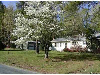 9712 Wilson Road Wilsons, VA 23894 - Photo 1 of 1 a front view of a house with a yard