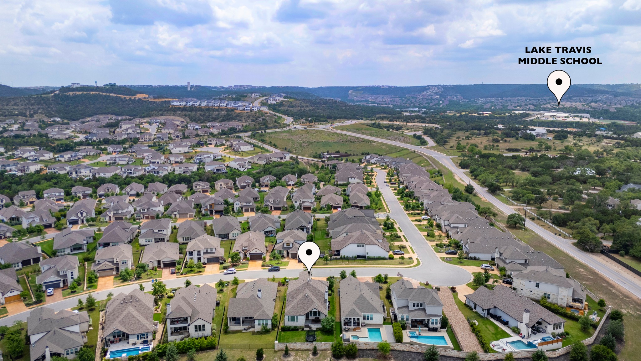 510 Elworth Path Austin, TX 78738 - Photo 30 of 40 an aerial view of a city with lots of residential buildings