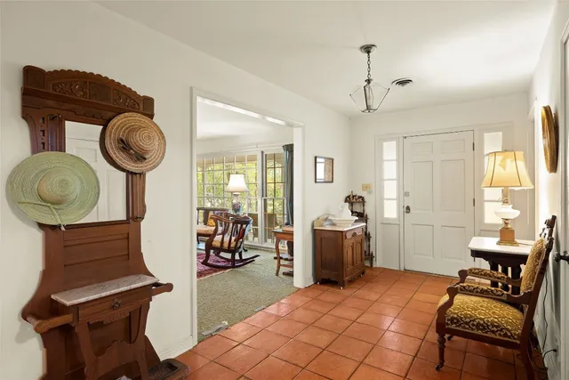 a bedroom with furniture and a window