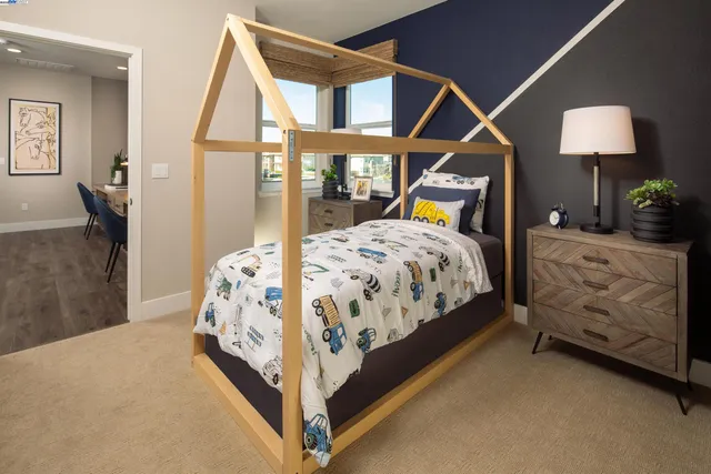 a bedroom with bed and a window