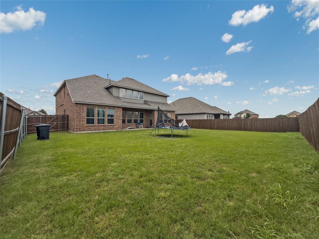 116 Chaco Drive Forney, TX 75126 - Photo 26 of 27 a front view of house with yard and seating area