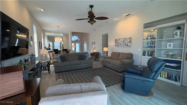 a living room with furniture or couch and a wooden floor