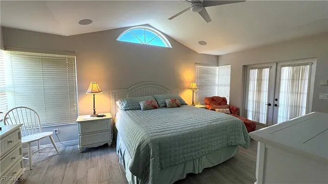 a bedroom with a bed and a table