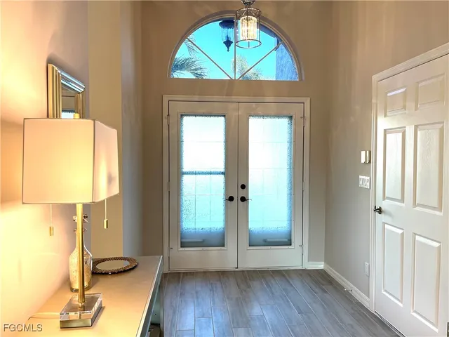 a view of front door with wooden floor