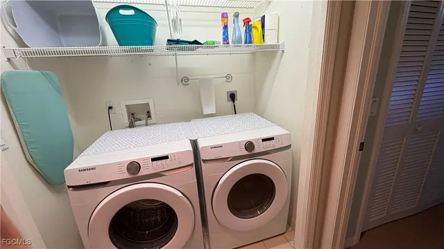 a utility room with dryer and washer