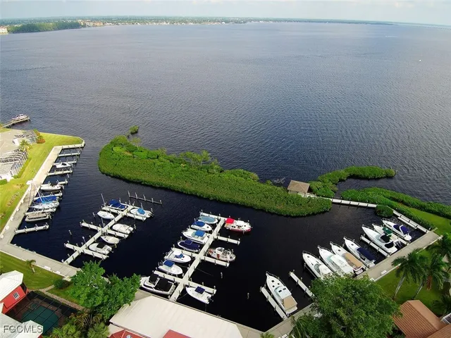an aerial view of a house a yard and outdoor seating