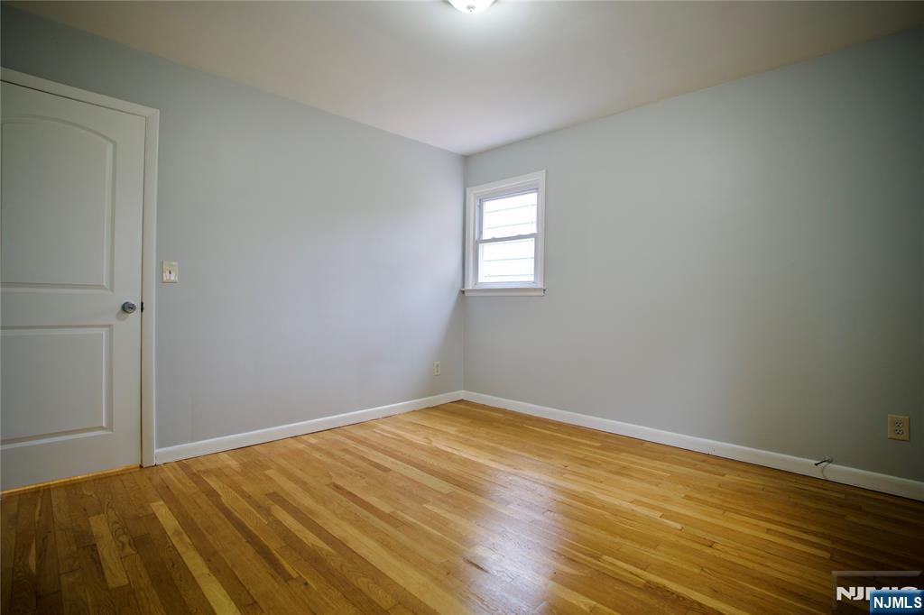 524 Studio Road, Unit 1 Ridgefield, NJ 07657 - Photo 30 of 44 wooden floor in an empty room