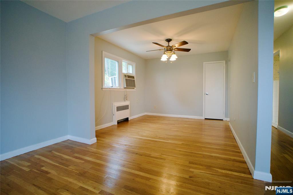 524 Studio Road, Unit 1 Ridgefield, NJ 07657 - Photo 6 of 44 a view of empty room with wooden floor