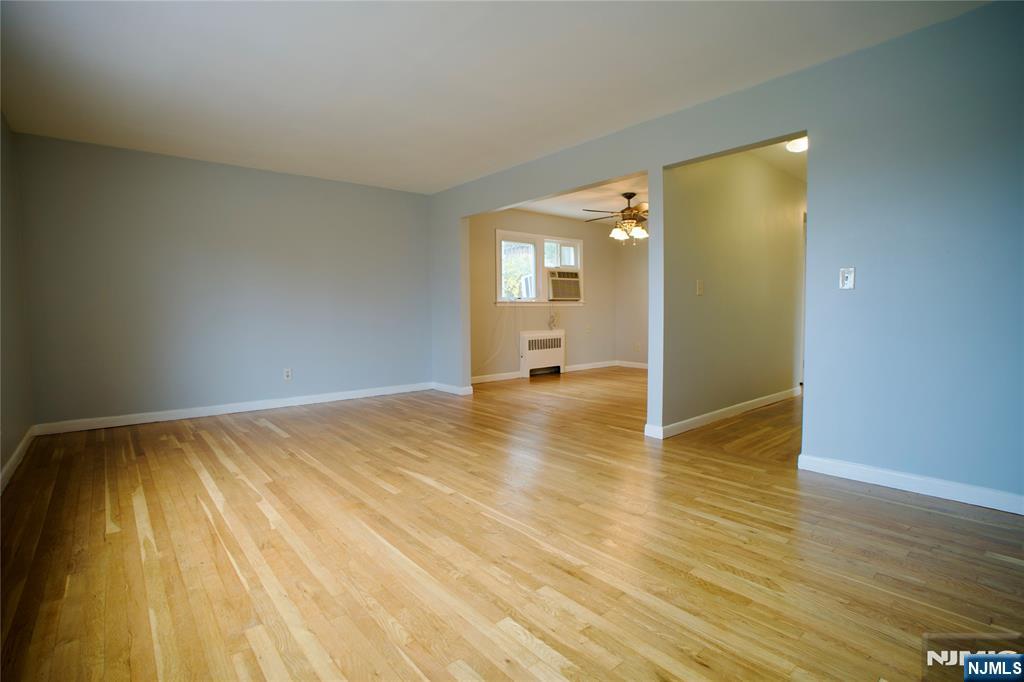 524 Studio Road, Unit 1 Ridgefield, NJ 07657 - Photo 9 of 44 a view of a room with wooden floor and a bathroom