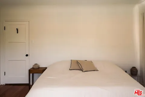 a bedroom with a bed and a cabinets