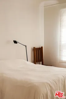 a bedroom with a bed and a cabinets