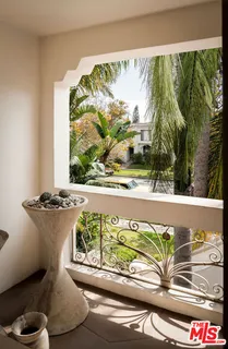 a view of a house with a balcony and door