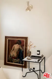 a workspace with furniture and chandelier