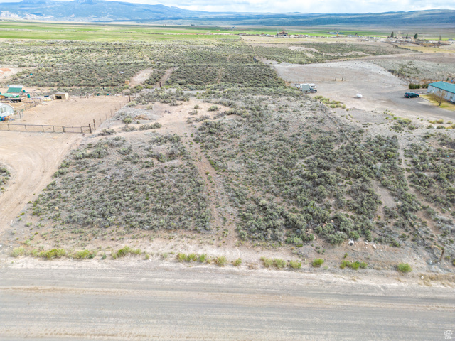 1400 East Highline Road, Unit 1 Loa, UT 84747 - Photo 9 of 17 Aerial view of sparsely populated area featuring a mountain backdrop and a desert landscape