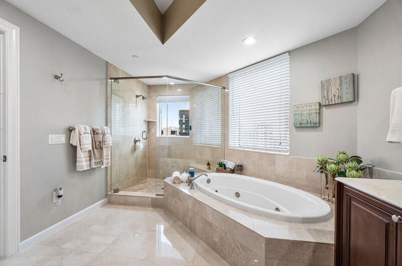 4600 North Ocean Drive, Unit 1603 Singer Island, FL 33404 - Photo 13 of 43 a bathroom with a tub sink and mirror