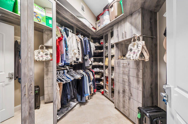 4600 North Ocean Drive, Unit 1603 Singer Island, FL 33404 - Photo 15 of 43 a view of walk in closet with clothes
