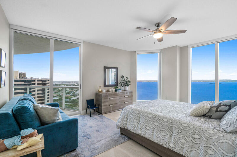 4600 North Ocean Drive, Unit 1603 Singer Island, FL 33404 - Photo 16 of 43 a bedroom with a large bed and a window