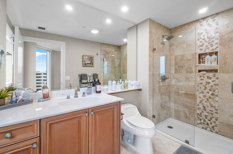 4600 North Ocean Drive, Unit 1603 Singer Island, FL 33404 - Photo 18 of 43 a bathroom with a sink a toilet and shower