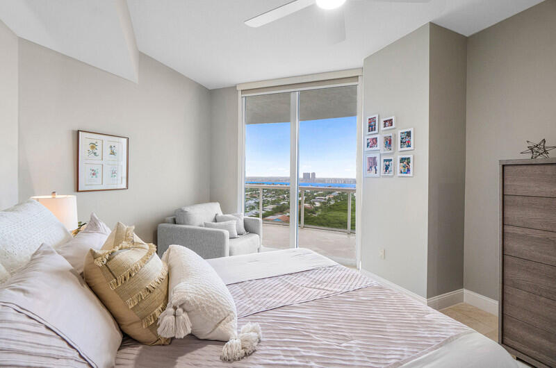 4600 North Ocean Drive, Unit 1603 Singer Island, FL 33404 - Photo 20 of 43 a bedroom with a bed and a window