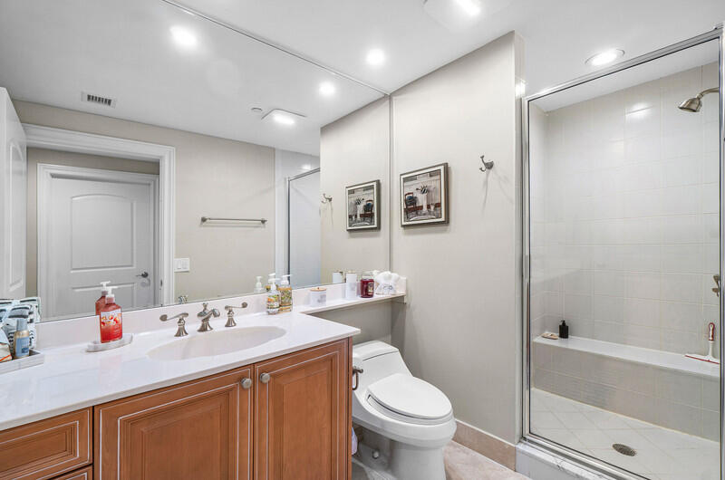 4600 North Ocean Drive, Unit 1603 Singer Island, FL 33404 - Photo 21 of 43 a bathroom with a sink toilet and shower