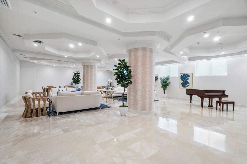 4600 North Ocean Drive, Unit 1603 Singer Island, FL 33404 - Photo 32 of 43 a living room with furniture and a table