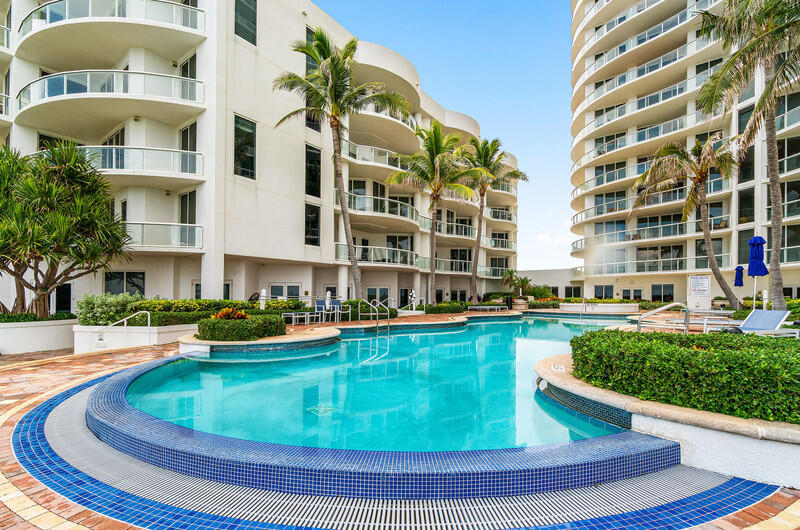 4600 North Ocean Drive, Unit 1603 Singer Island, FL 33404 - Photo 36 of 43 a view of a swimming pool with a lounge chairs