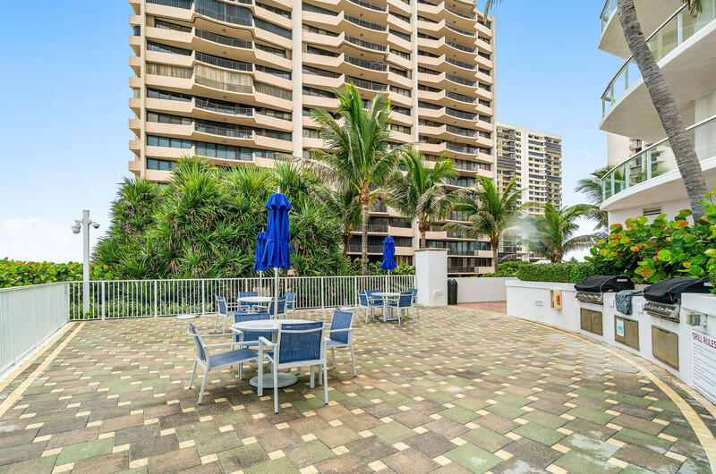 4600 North Ocean Drive, Unit 1603 Singer Island, FL 33404 - Photo 38 of 43 a view of a chairs and table in the patio