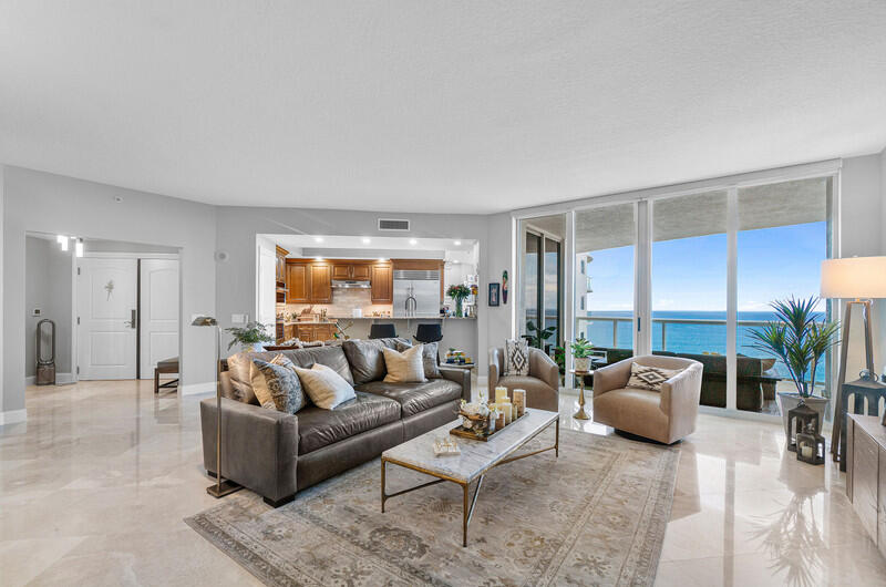 4600 North Ocean Drive, Unit 1603 Singer Island, FL 33404 - Photo 7 of 43 a living room with furniture and a large window