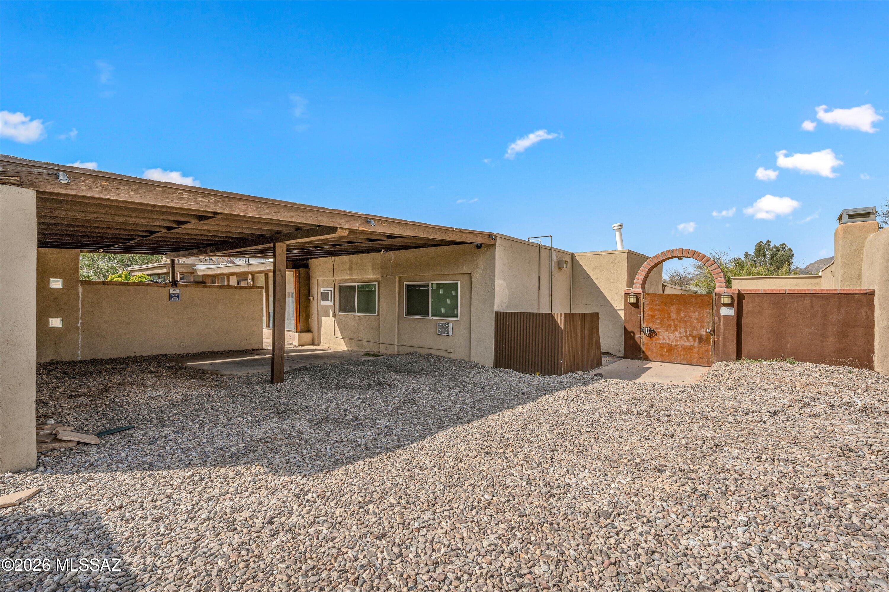 2619 East Prince Road Tucson, AZ 85716 - Photo 7 of 50 a front view of a house with a yard