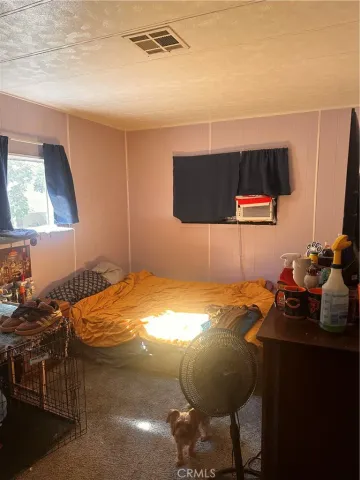 a bedroom with a bed and furniture
