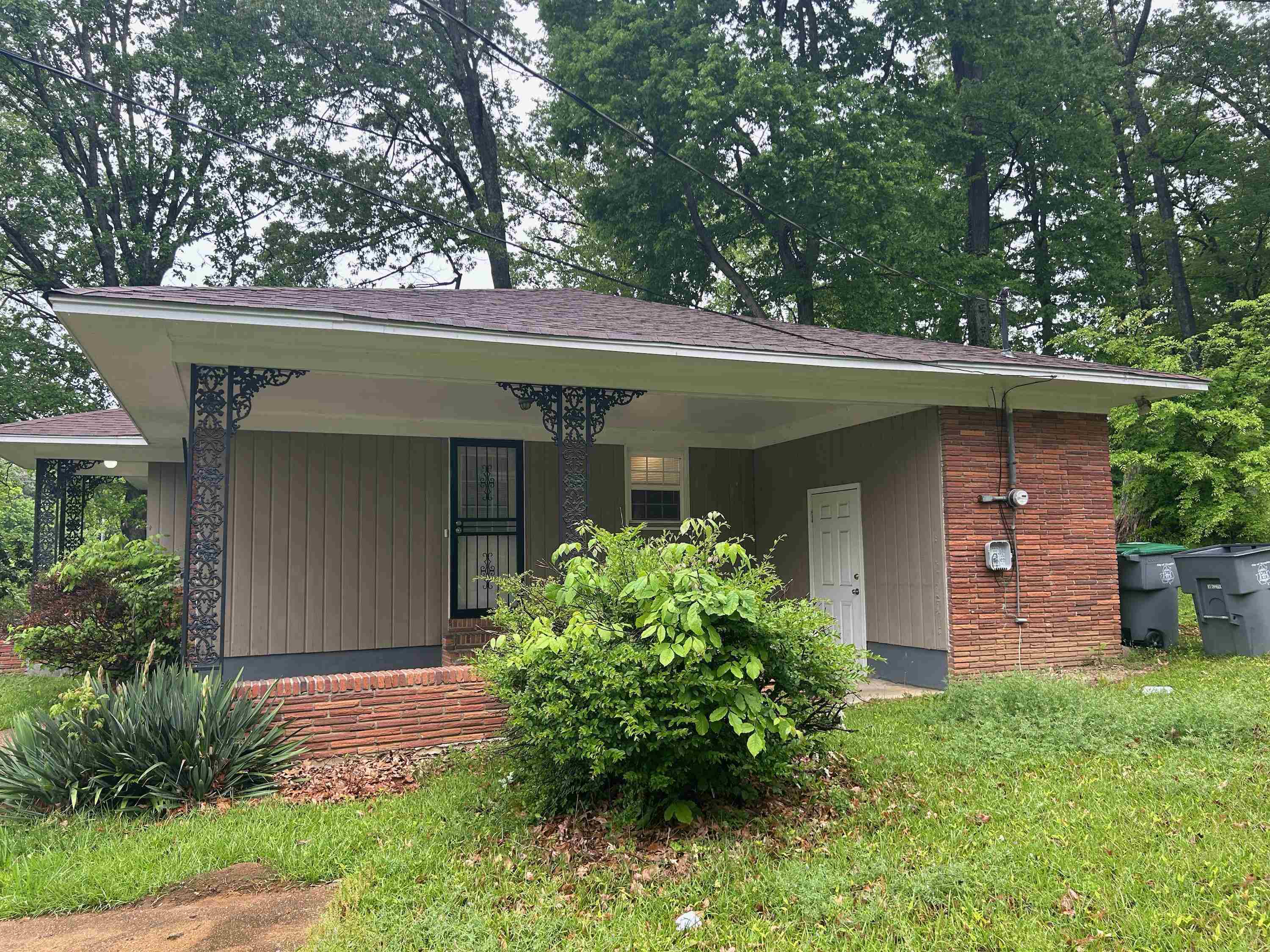 3282 Rickey Road Memphis, TN 38128 - Photo 2 of 4 front view of a house with a yard