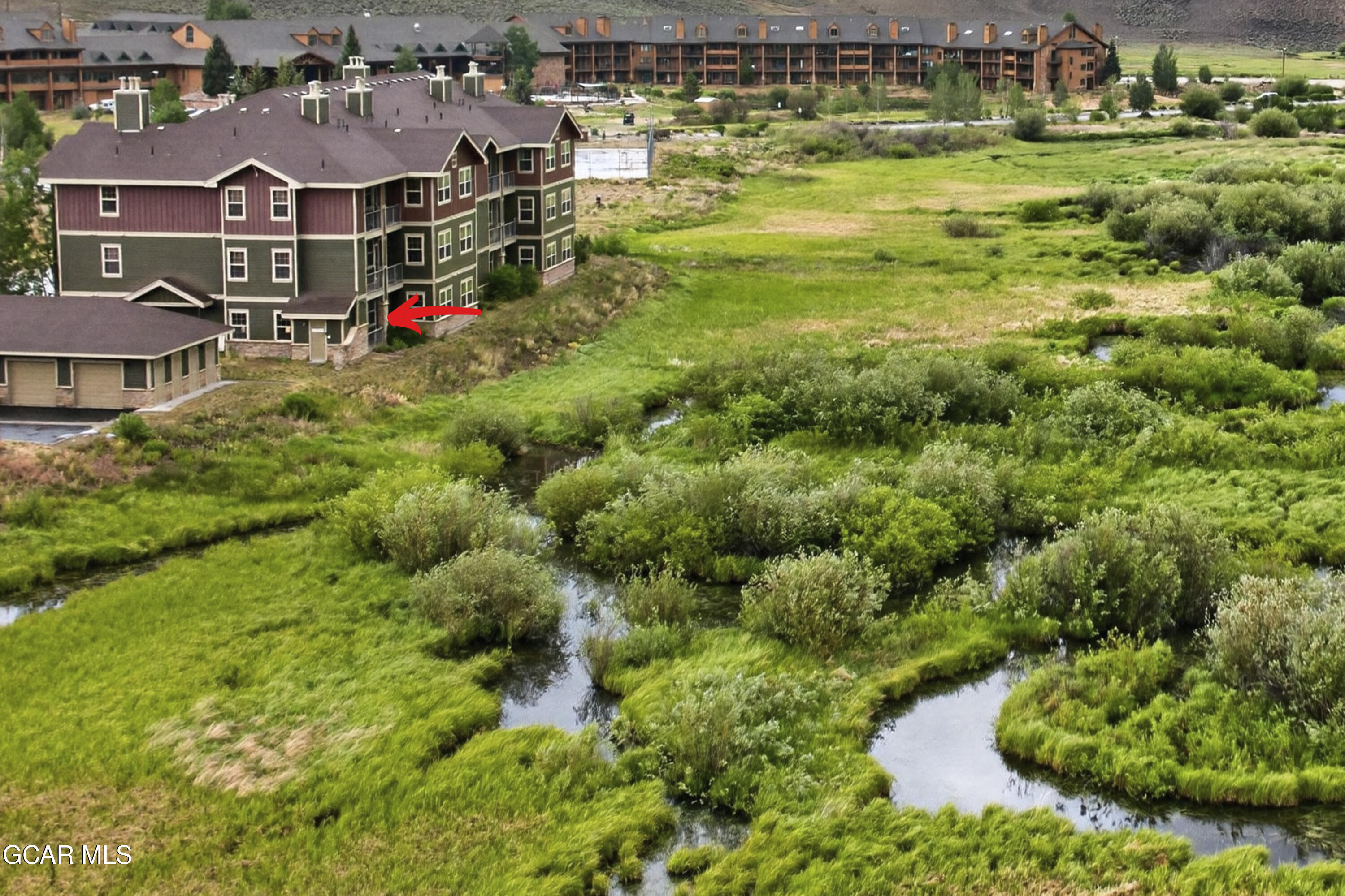 154 Village Road, Unit C106 Granby, CO 80446 - Photo 2 of 38 Backing the creek