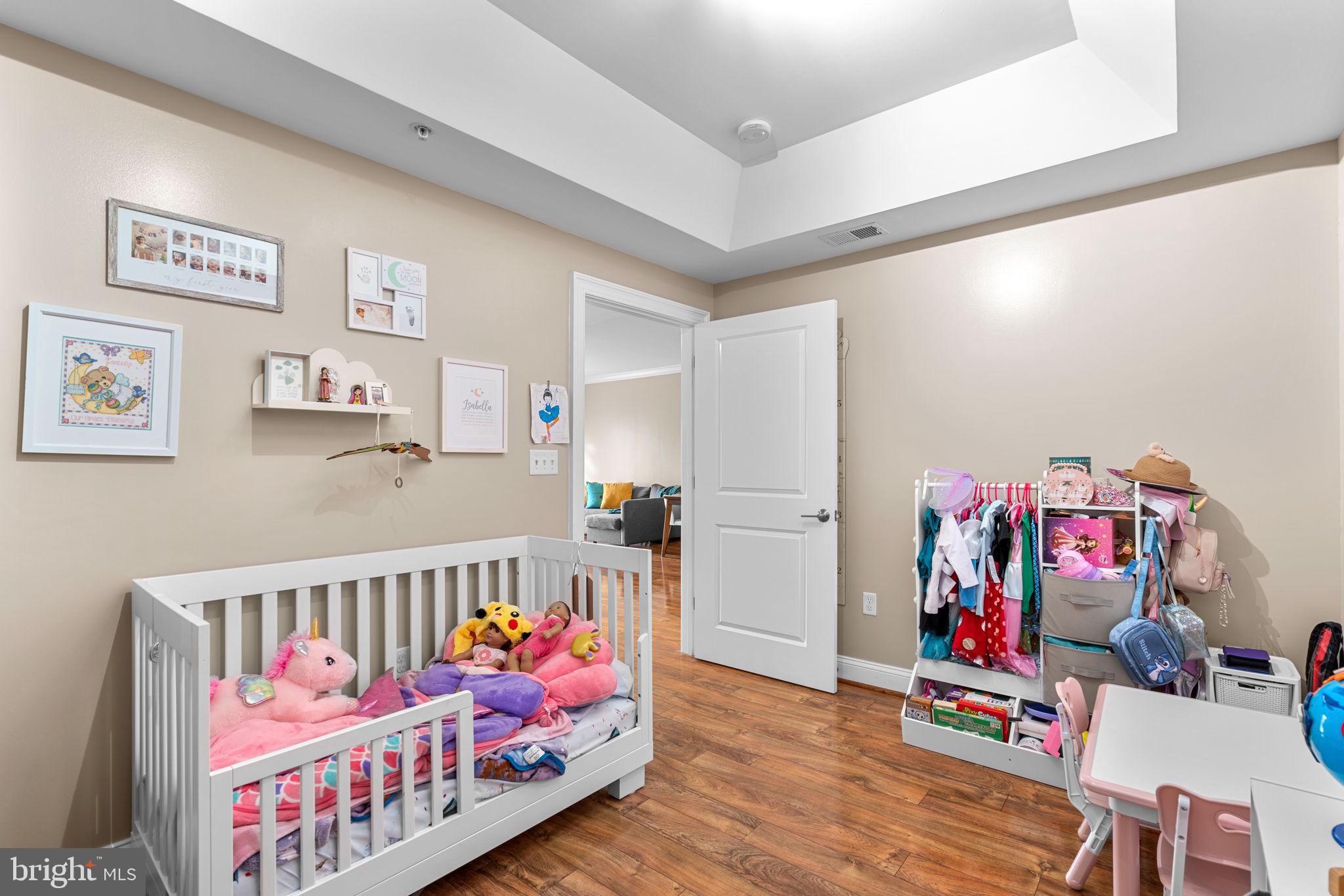 6301 Edsall Road, Unit 500 Alexandria, VA 22312 - Photo 15 of 30 a bedroom with furniture and wooden floor